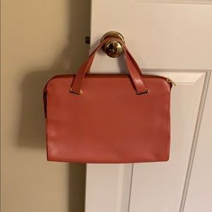 Suarez light coral pebble top handle bag